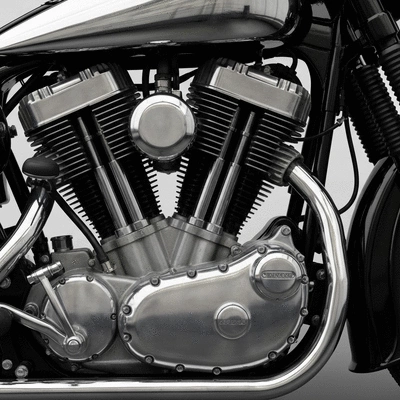Close-up of a perfectly restored vintage motorcycle engine, gleaming chrome and polished metal, focus on detail and quality craftsmanship